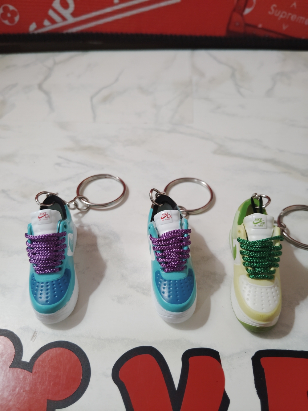Nike Kids Teal Mini Sneaker Keychain with Purple Laces